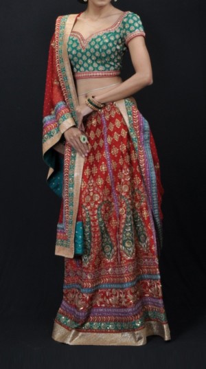 inexperienced red color lehenga with intricate embroideryA