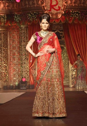 awesome heavy embroidered magenta and red designer bridal lehenga
