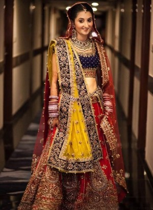 engrossing your look with maroon and yellow color designer bridal lehenga