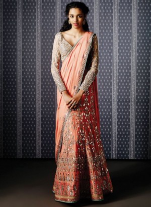 Peach Silk Mehendi Sangeet Function Wearing Lehenga Saree with Gota Patti Work at Zikimo