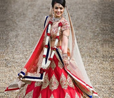 Designer Red Heavy Bridal Lehenga with Gold Embroidery at Zikimo