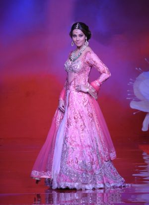 Fascinating Pink Net Couture Wedding Gown with Swarovski Work at Zikimo