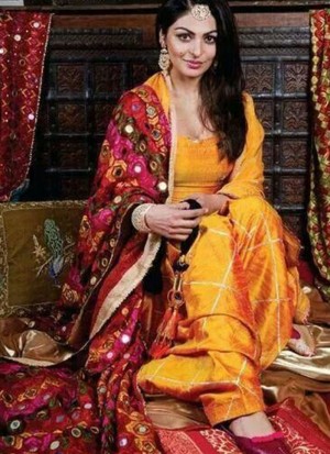 Neeru Bajwa Mango Yellow color Raw Silk Punjabi Salwar Kameez With Phulkari Dupatta at Zikimo